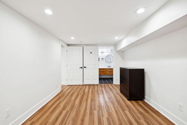 interior space with recessed lighting, baseboards, and light wood finished floors