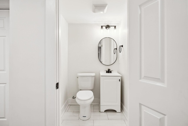 bathroom with visible vents, baseboards, toilet, and vanity