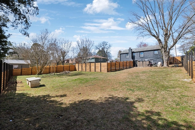 view of yard with a fenced backyard