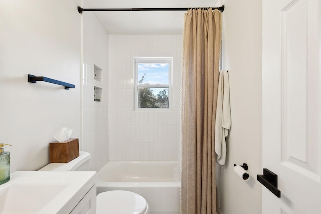 bathroom with vanity, shower / bath combination with curtain, and toilet