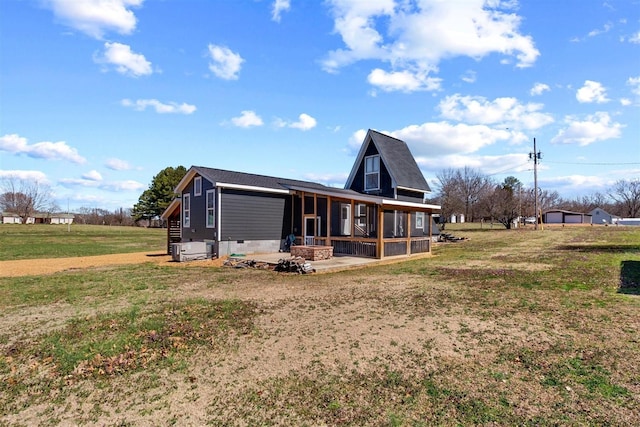 exterior space with a patio, a lawn, a sunroom, and crawl space