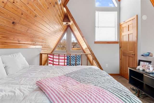 bedroom with carpet and vaulted ceiling