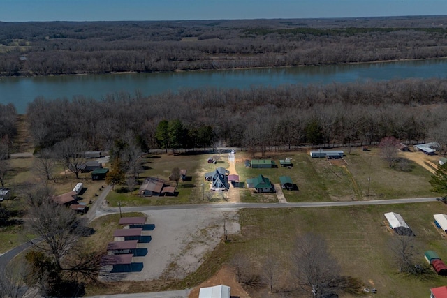 aerial view with a water view and a wooded view