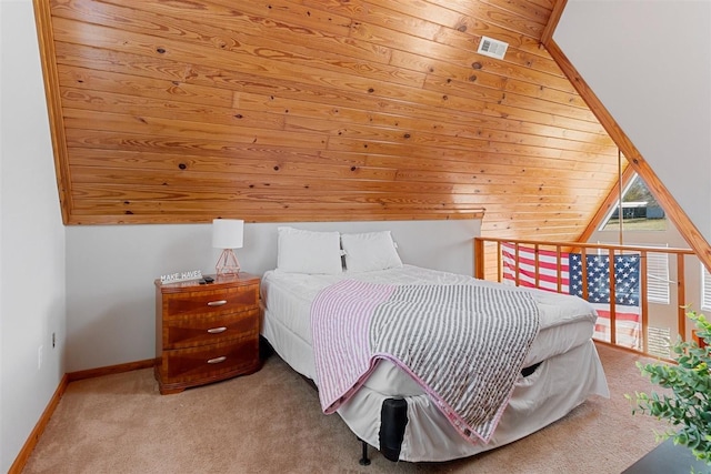 carpeted bedroom with visible vents and baseboards