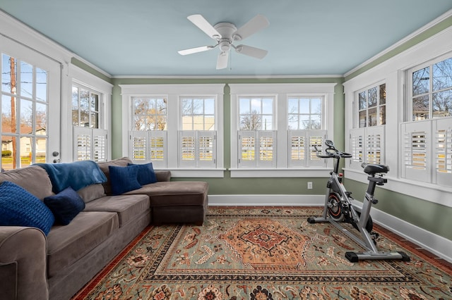 sunroom with plenty of natural light and a ceiling fan