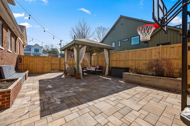 view of patio / terrace with a gazebo and a fenced backyard