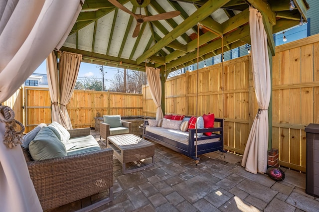 view of patio with outdoor lounge area and fence