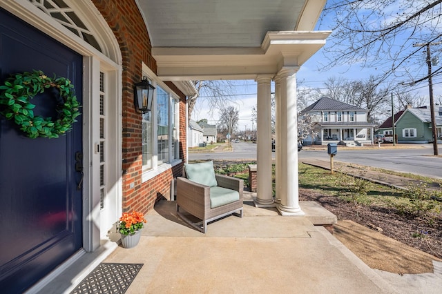 view of patio featuring a residential view and covered porch