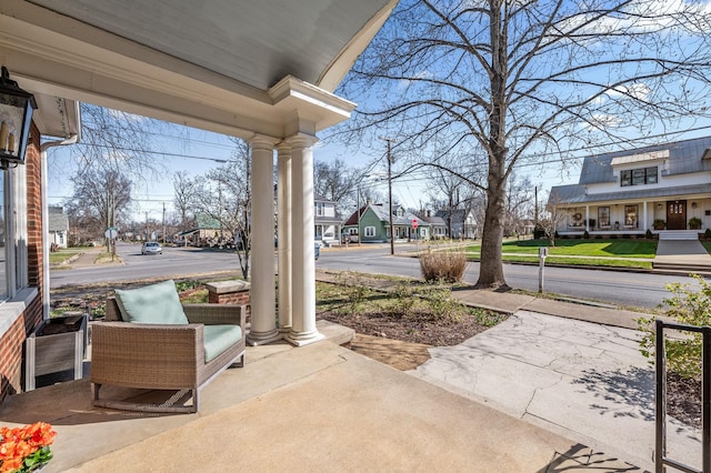 view of patio / terrace featuring a residential view and covered porch