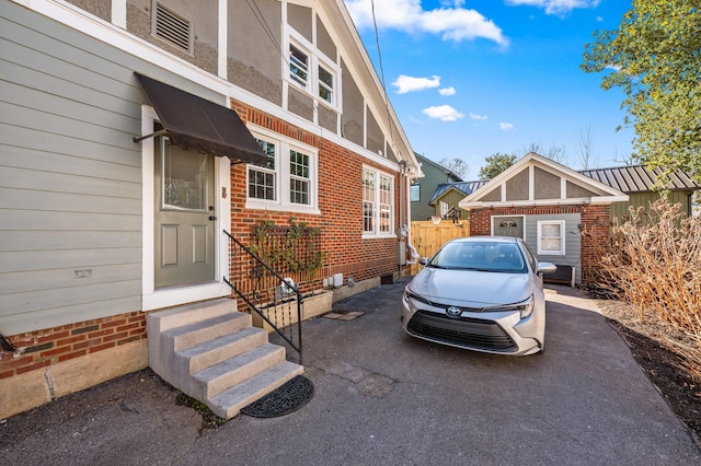 exterior space featuring crawl space and brick siding