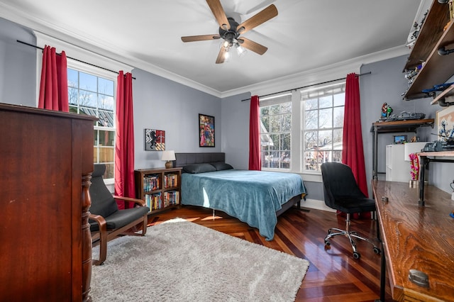 bedroom with crown molding, ceiling fan, and wood finished floors