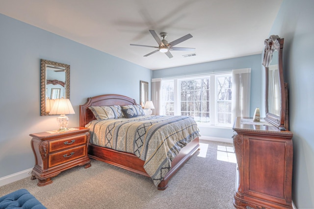 bedroom with visible vents, baseboards, carpet, and a ceiling fan