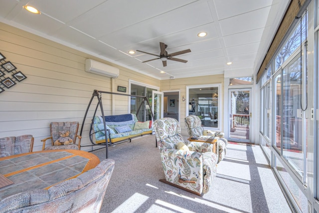 sunroom / solarium featuring a ceiling fan and a wall unit AC