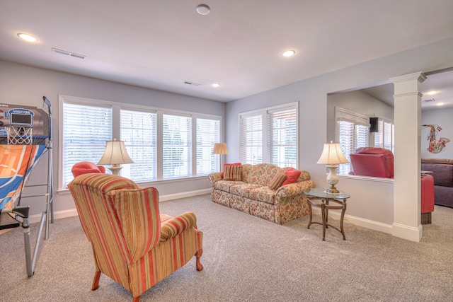 living room featuring visible vents, recessed lighting, baseboards, and decorative columns