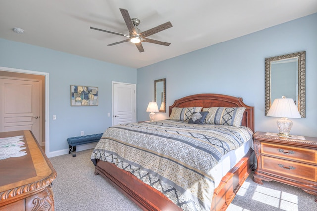 bedroom with carpet flooring, a ceiling fan, and baseboards