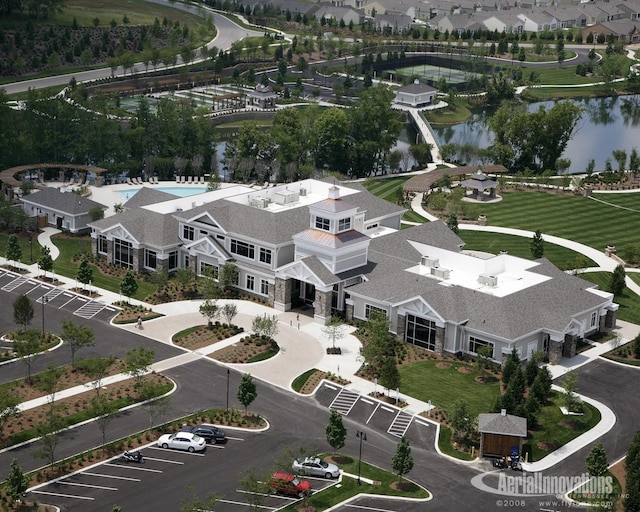 bird's eye view with a water view and a residential view