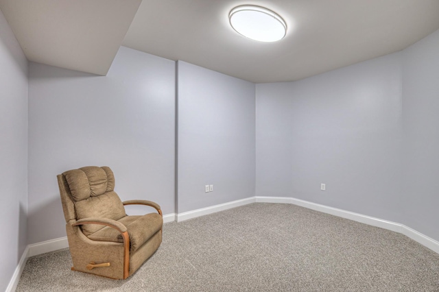 living area with carpet flooring and baseboards