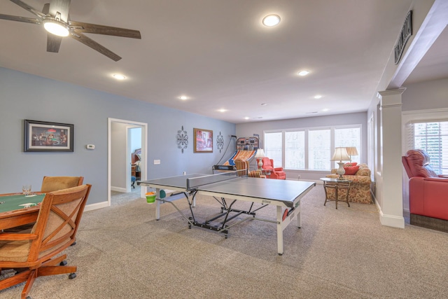 game room featuring light colored carpet, a healthy amount of sunlight, and ornate columns