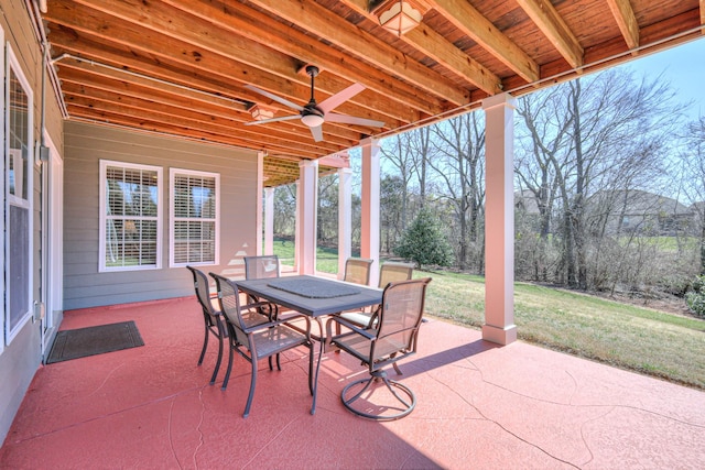 view of patio with outdoor dining area and ceiling fan