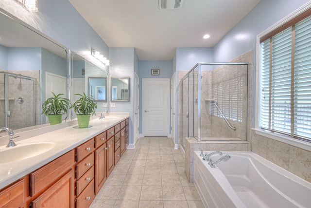 bathroom with a sink, visible vents, and a shower stall