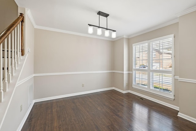 unfurnished room featuring visible vents, baseboards, dark wood-type flooring, and crown molding