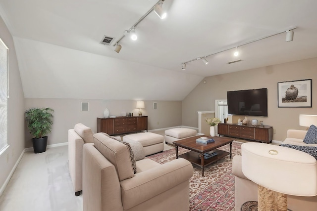 carpeted living area featuring visible vents, baseboards, and vaulted ceiling