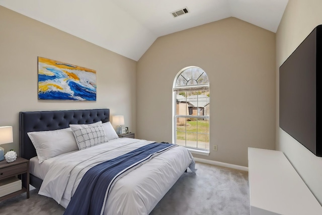 bedroom featuring visible vents, baseboards, lofted ceiling, and carpet floors