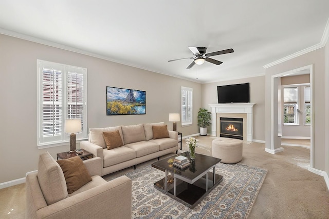 living area featuring a fireplace with flush hearth, light colored carpet, baseboards, and ornamental molding