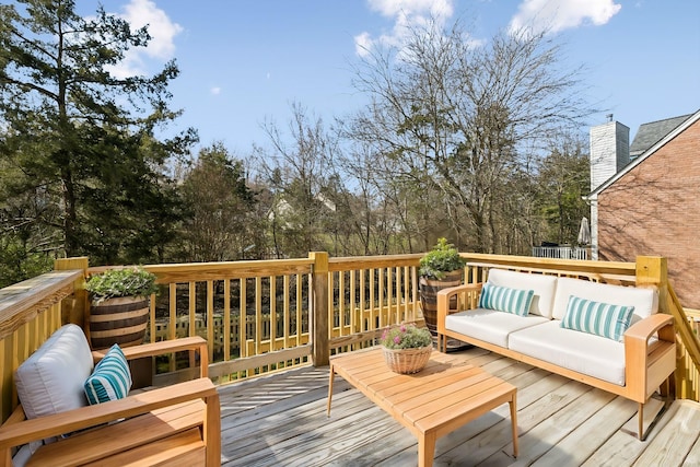 wooden deck with an outdoor hangout area