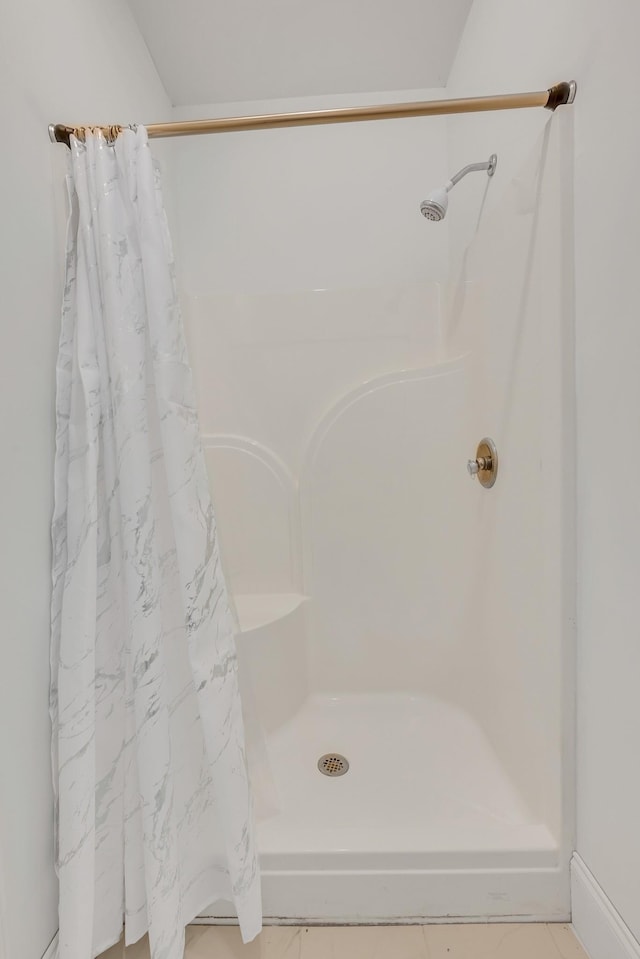 full bath featuring a shower stall