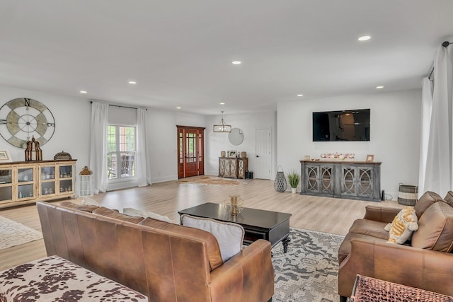 living room featuring light wood-style flooring and recessed lighting