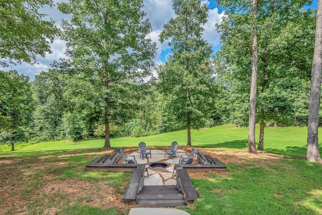 view of yard with a fire pit