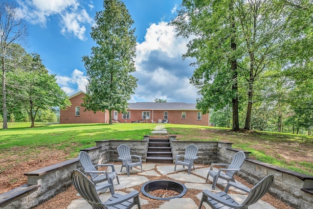 view of patio / terrace featuring an outdoor fire pit