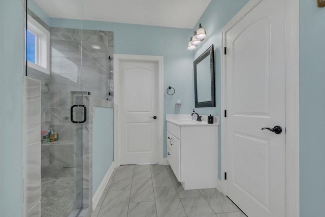 bathroom with a stall shower and vanity