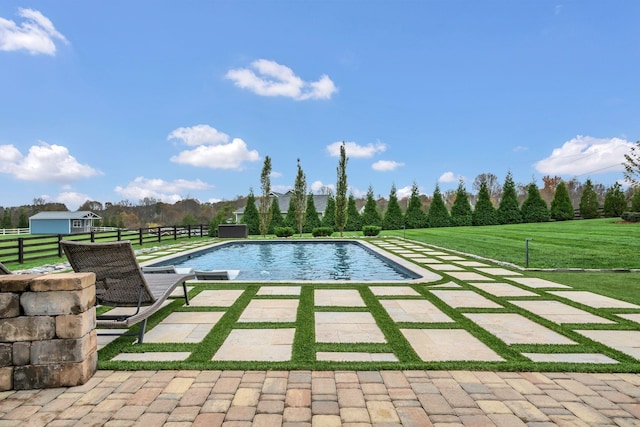 pool featuring a lawn, a patio, and fence