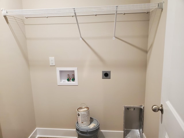 laundry room featuring laundry area, hookup for an electric dryer, baseboards, and washer hookup