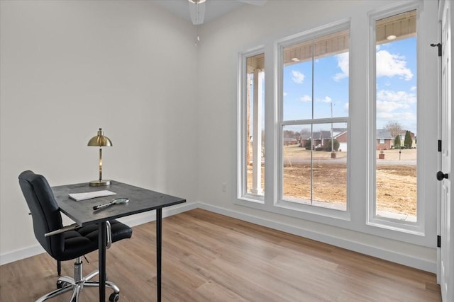 office area featuring baseboards, wood finished floors, and a ceiling fan