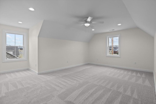 bonus room with baseboards, carpet, and vaulted ceiling