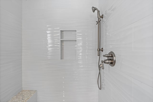 room details featuring tiled shower