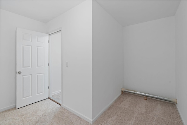 bonus room featuring baseboards and carpet flooring