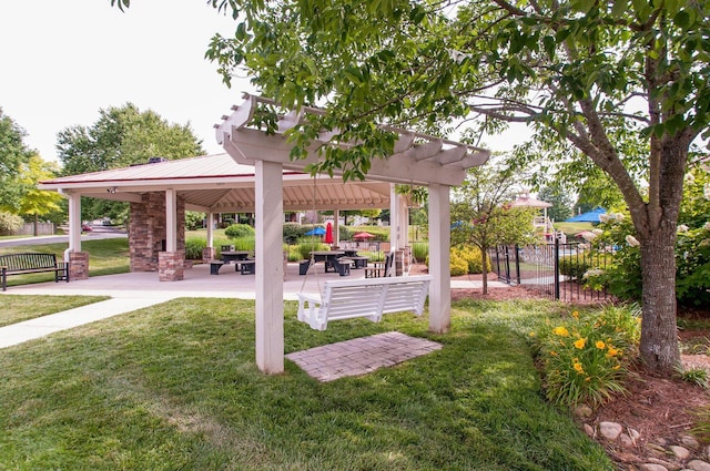 surrounding community featuring a patio, a lawn, a pergola, and fence