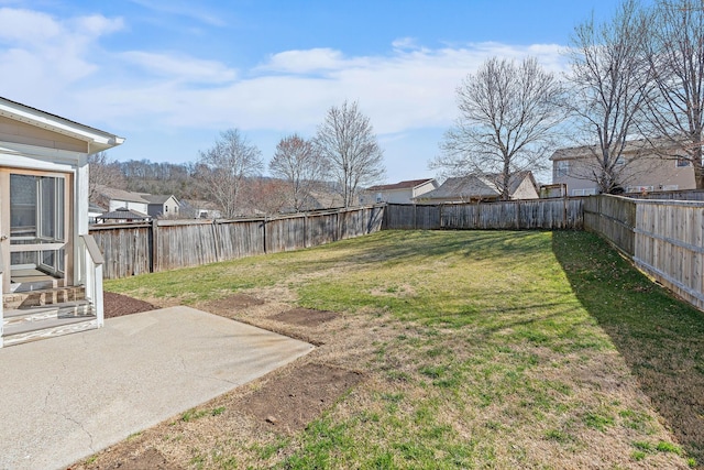 view of yard with a patio and a fenced backyard