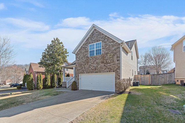 view of front of house with a front lawn, fence, brick siding, and central AC