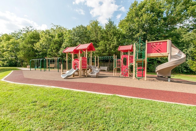 communal playground featuring a yard