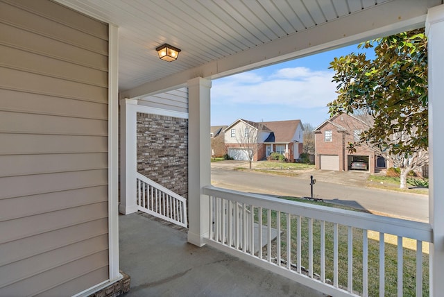 balcony with a residential view and covered porch