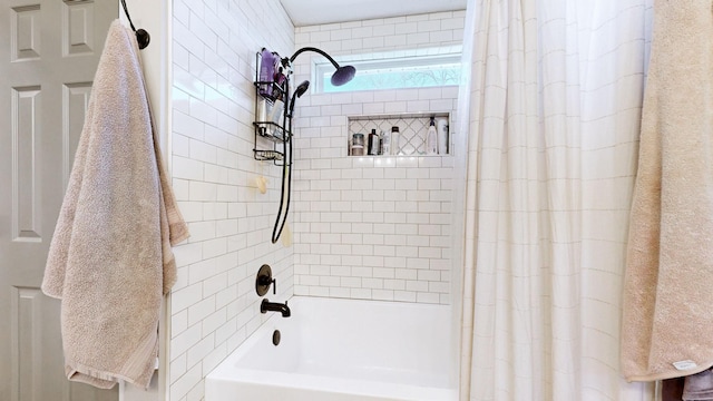 bathroom with shower / bathtub combination with curtain