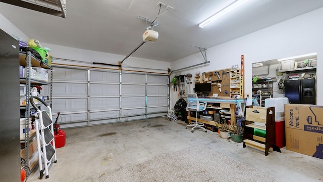 garage featuring black fridge with ice dispenser and a garage door opener