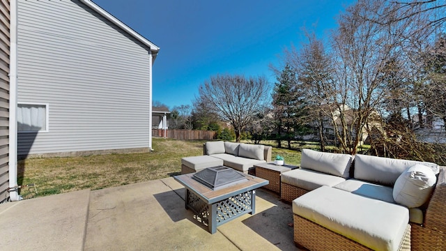 view of patio featuring outdoor lounge area and fence