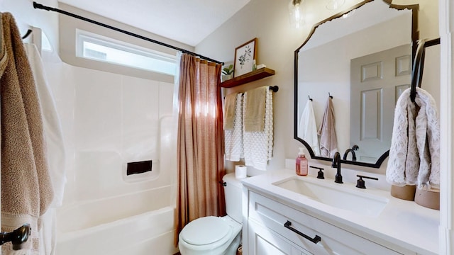 bathroom featuring toilet, shower / tub combo with curtain, and vanity