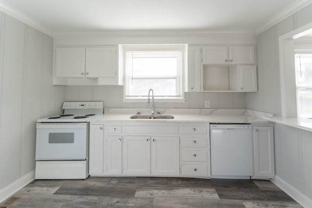 kitchen featuring a sink, white appliances, white cabinets, and wood finished floors